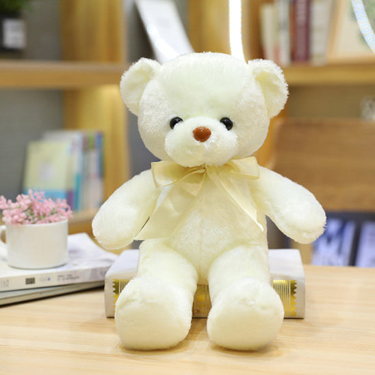 Ours peluche ruban blanc embellit l'ours
