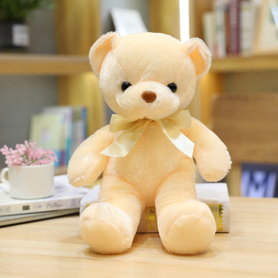 Ours peluche ruban jaune apporte une touche élégante au doudou