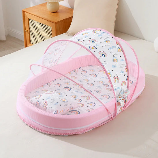 Lit pour bebe en toile rose motif  arc-en-ciel