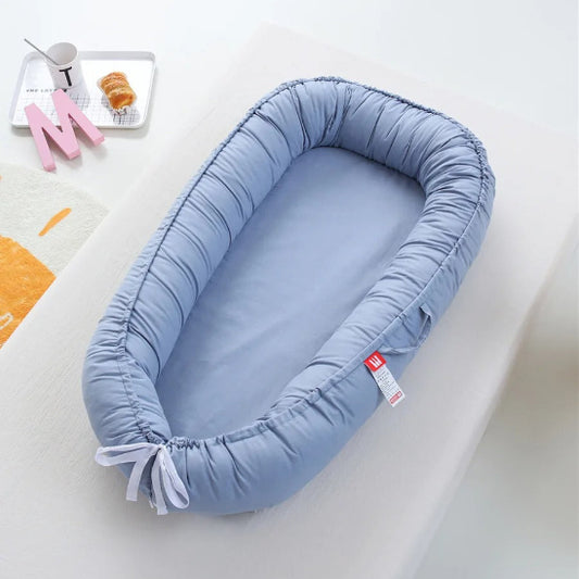 Reducteur de lit cododo bleu grisâtre enveloppe bébé