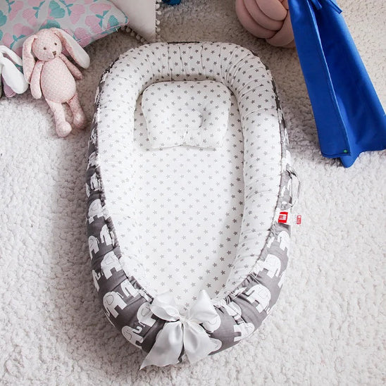 Reducteur lit bebe fixation sécurisée empêchant tout déplacement du réducteur