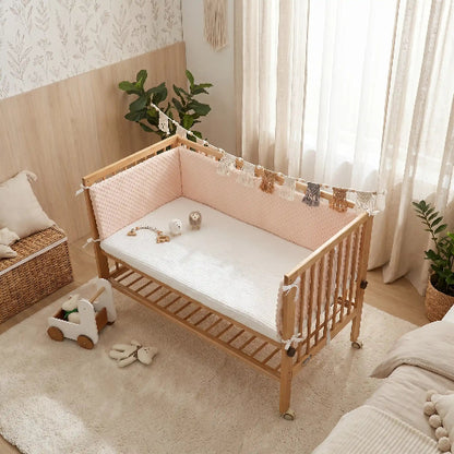Tour de lit berceau cododo embellissant la chambre de bébé